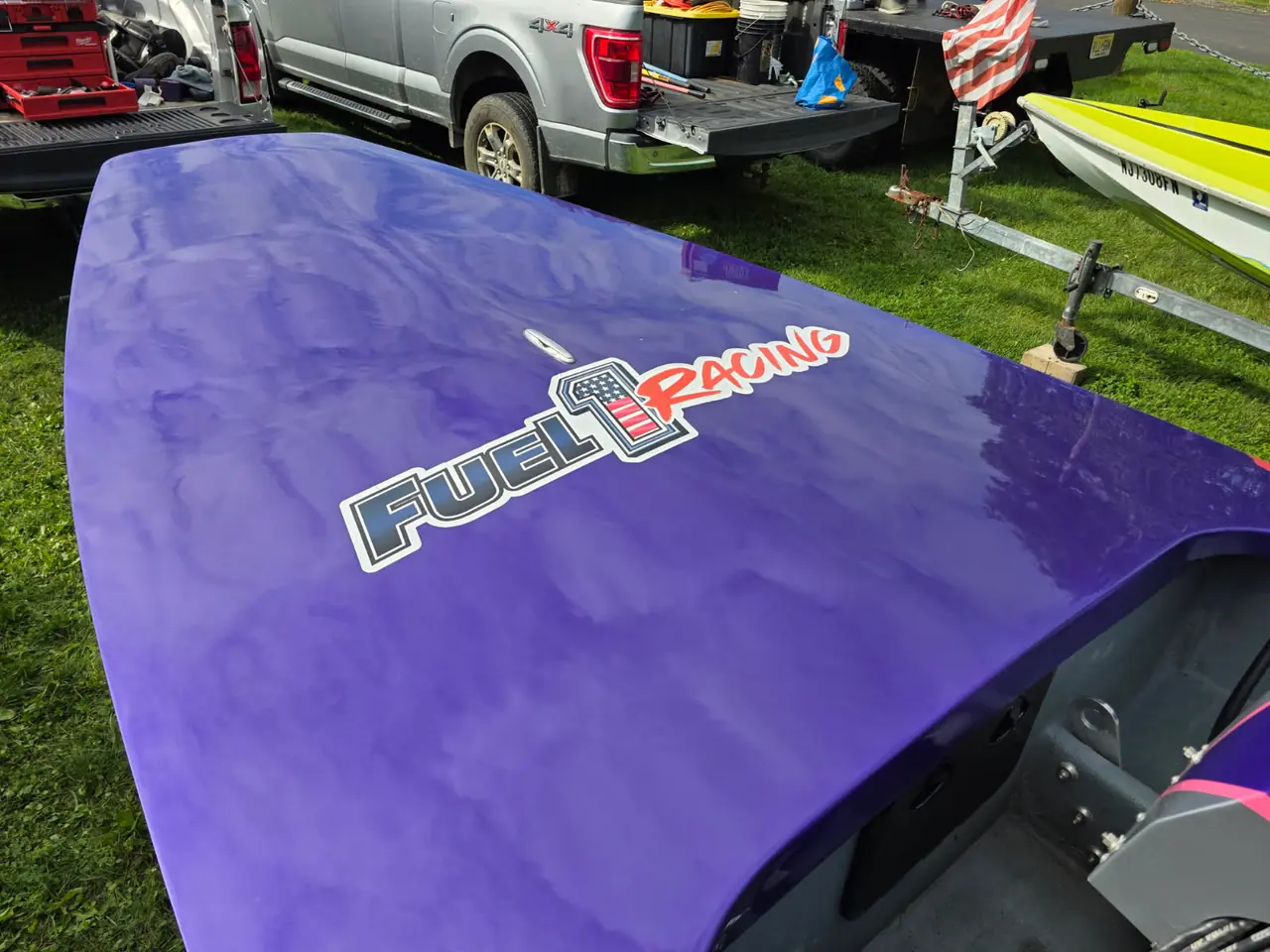 Close-up of the Fuel 1 Racing logo on a purple race-boat deck