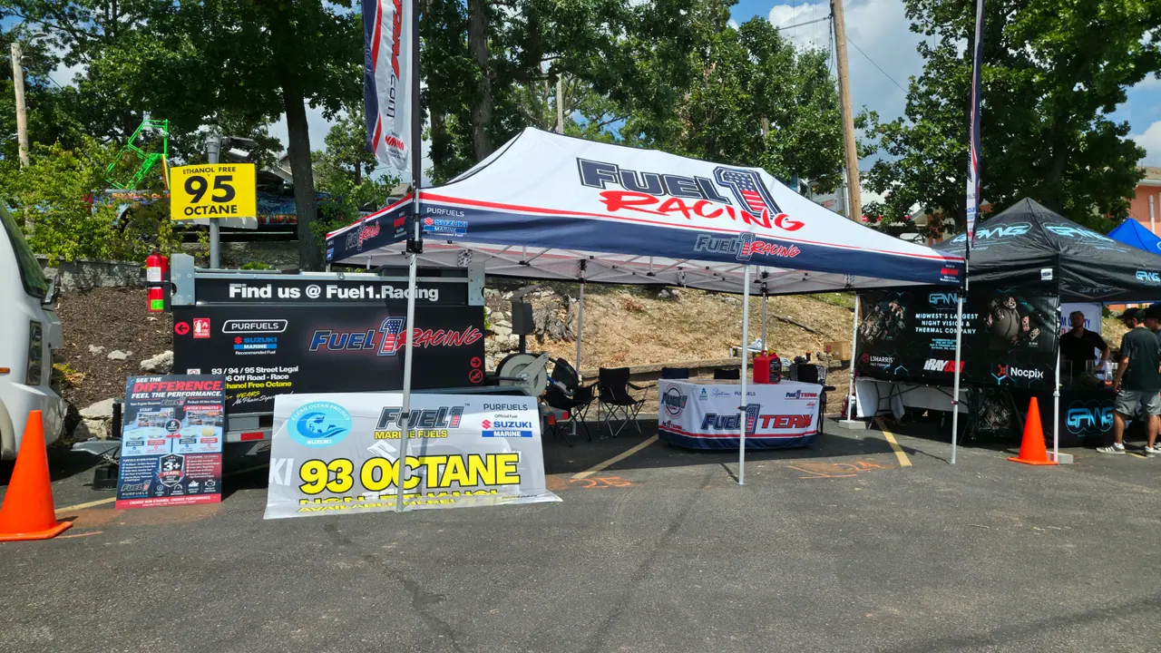 Fuel 1 Racing tent with a 93 octane banner and fuel station in a race-site lot