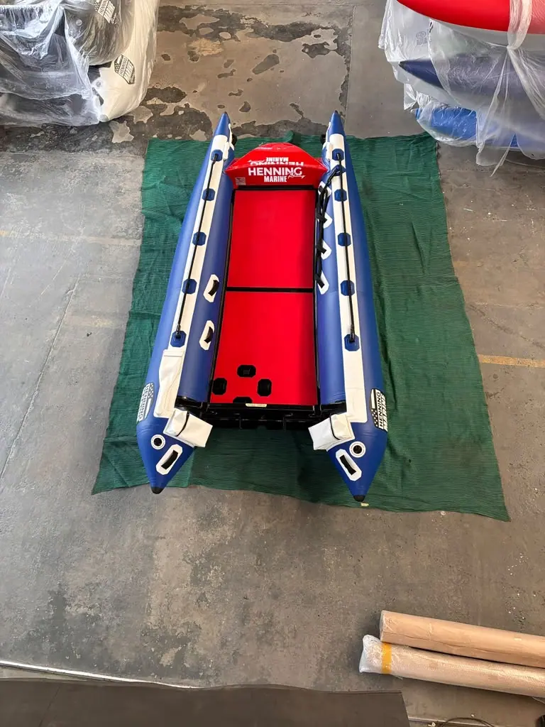 Looking down the length of the Fuel 1 Team ThunderCat: a red deck between blue and white sponsons
